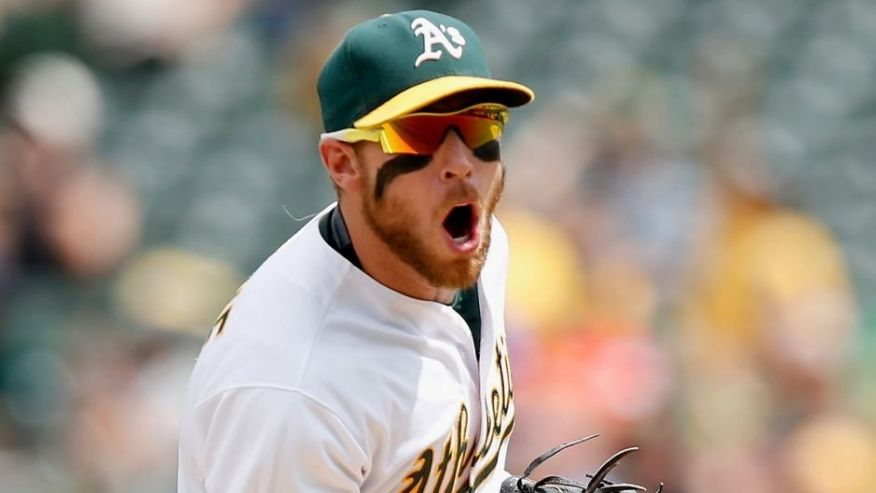 OAKLAND CA- JULY 01 Brett Lawrie #15 of the Oakland Athletics reacts after he fielded the ball with his bare hand and threw out Ben Paulsen #10 of the Colorado Rockies in the sixth inning