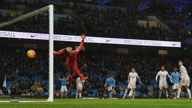 A shot from Yaya Toure deflects into goal off the back of Kelechi Iheancho to give Manchester City a 2-1 win over Swansea City