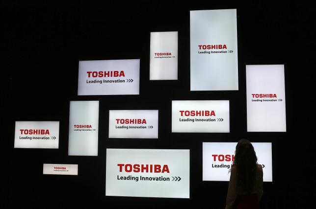 A visitor looks at a display of Japan's Toshiba company during the IFA Electronics show in Berlin