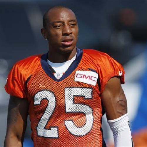 Denver Broncos cornerback Chris Harris takes a break during drills at the team's NFL football training camp session in Englewood Colo. Denver's defense is ranked first in stopping both