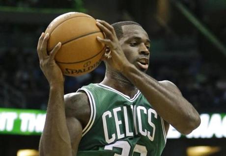 Boston Celtics&apos Brandon Bass grabs a rebound against the Orlando Magic during the second half of an NBA basketball game in Orlando Fla. Friday Nov. 8 2013. Boston Celtics won the game 91-89