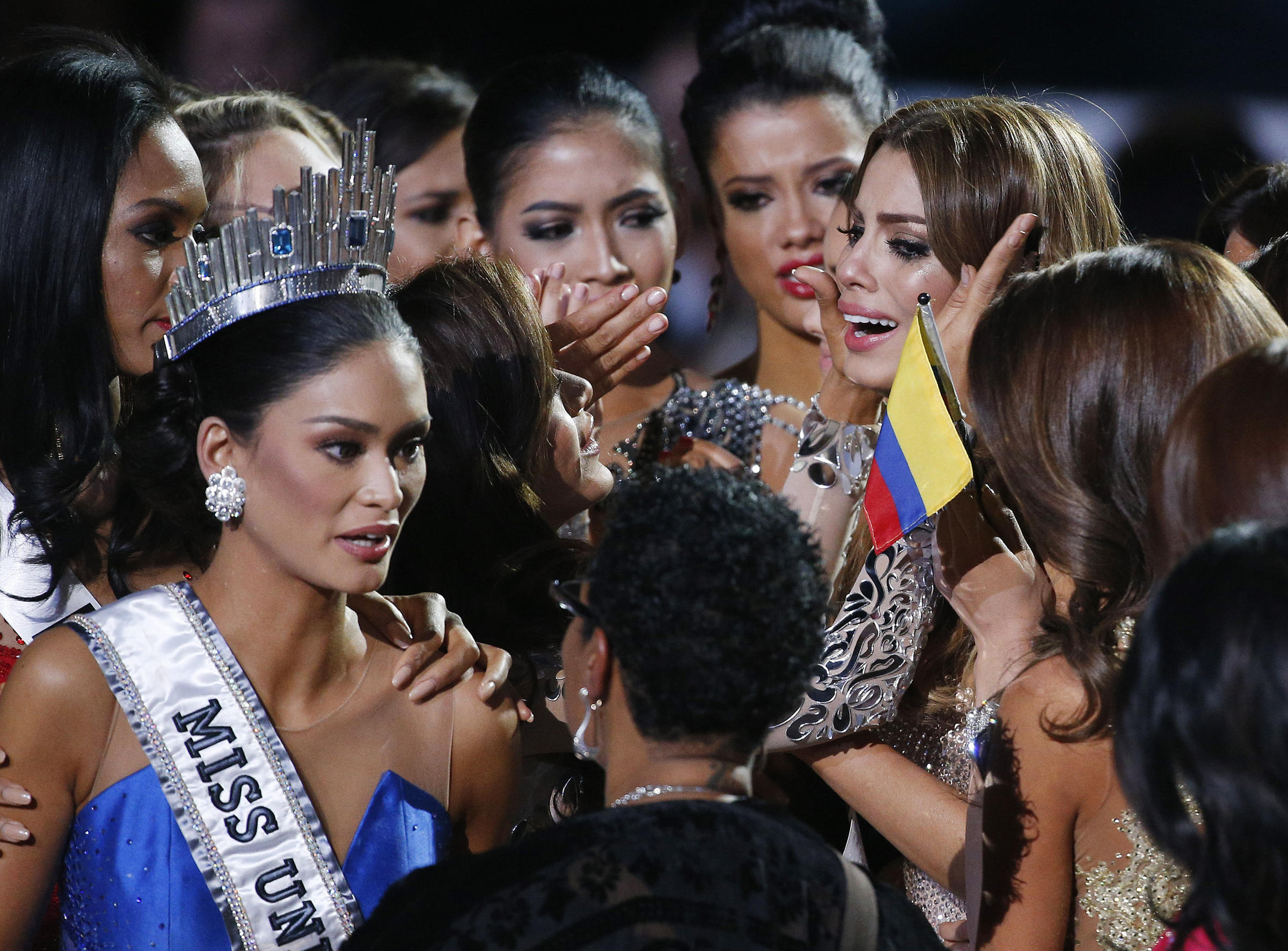 Other contestants comfort Miss Colombia Ariadna Gutierrez top right after she was incorrectly crowned Miss Universe at the Miss Universe pageant on Sunday in Las Vegas