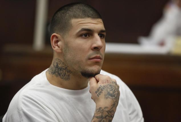 Former New England Patriots tight end Aaron Hernandez is charged with killing two Boston men in 2012 after a chance encounter at a nightclub