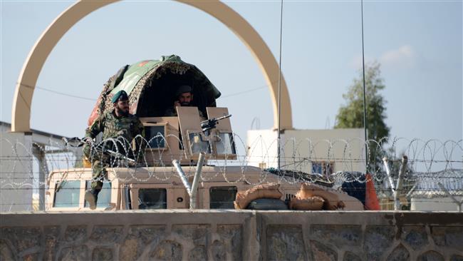 Afghan National Army soldiers keep watch after clashes against security forces at Kandahar Airport