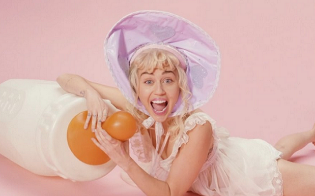 Miley Swaps Wrecking Balls For Giant Baby Bottles In New 'BB Talk' Video