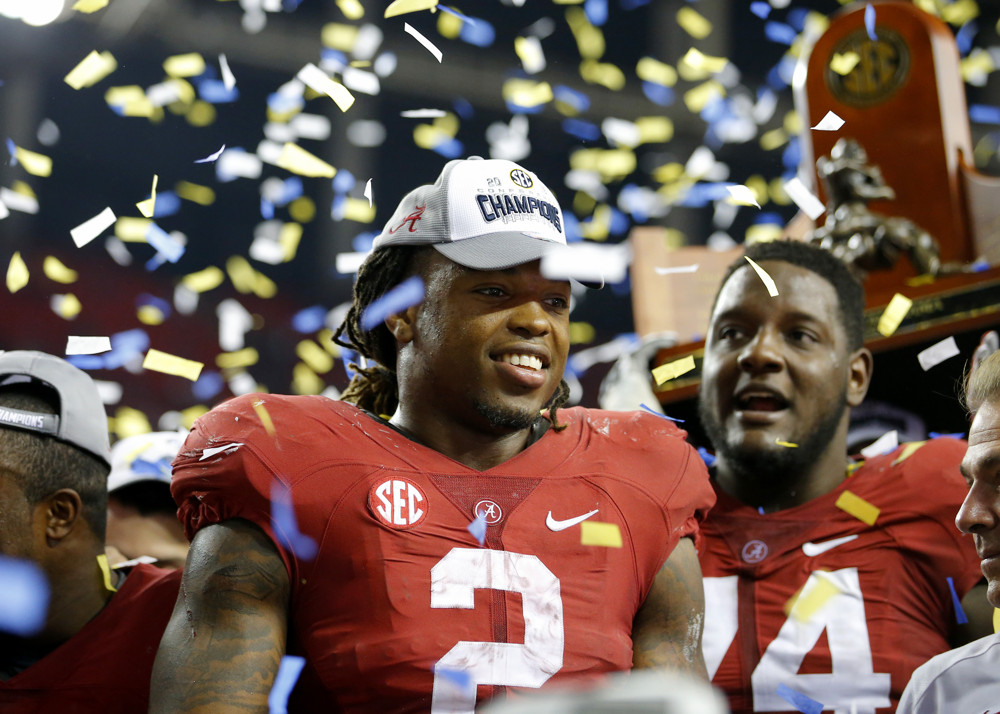 Alabama Crimson Tide running back Derrick Henry celebrates the victory during the trophy presentation in the Alabama Crimson Tide 29-15 victory over the Florida Gators in the SEC Championship game at the Georgia Dome in Atlanta GA