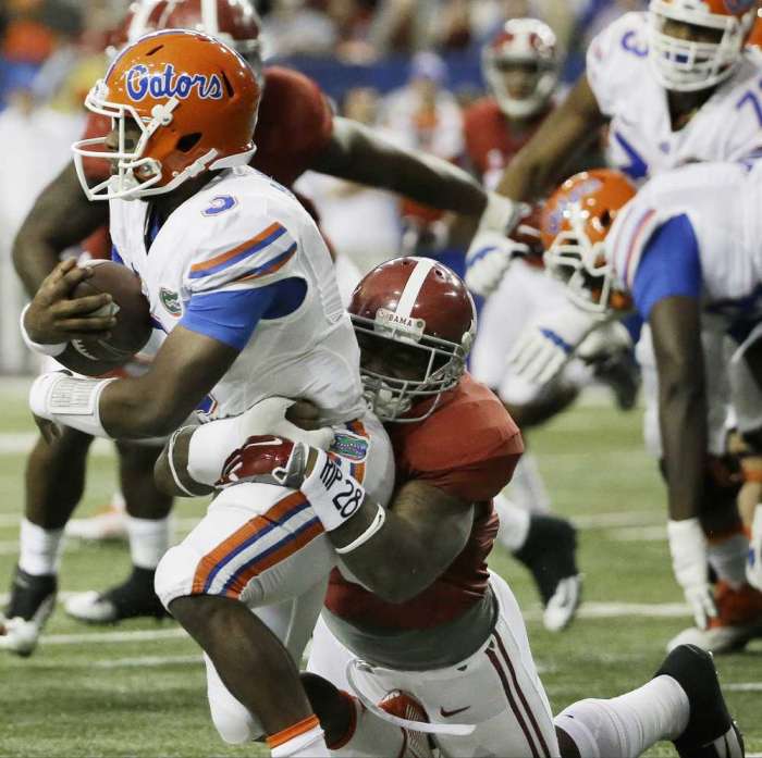 David Goldman Associated Press Florida quarterback Treon Harris is tackled by Alabama linebacker Reuben Foster during the first half of the SEC championship game on Saturday in Atlanta. AP