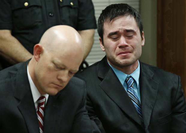 Daniel Holtzclaw right cries as the verdicts are read in his trial in Oklahoma City Thursday Dec. 10 2015. At left is defense attorney Robert Gray. Holtzclaw a former Oklahoma City police officer was facing dozens of charges alleging he sexually