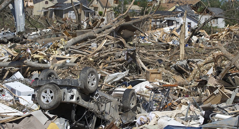 Cars and homes lay in ruins in Tuscaloosa Alabama