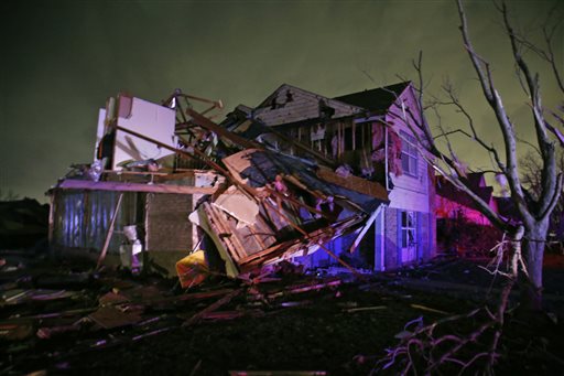 Debris lies on the ground near a home that was heavily damaged by a tornado in Rowlett Texas Saturday Dec. 26 2015. Tornadoes swept through the Dallas area after dark on Saturday evening causing significant damage. (Guy Reynolds  The Dallas Morning New