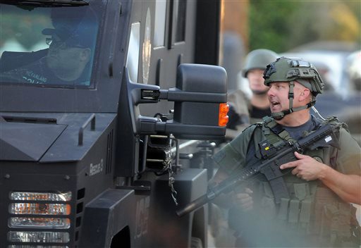 Authorities prepare to search an area near a church on Wednesday Dec. 2 2015 following a shooting that killed multiple people at a social services center for the disabled in San Bernardino Calif. MAND