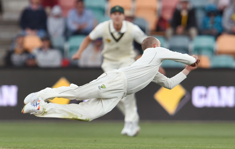 AFP  William West Australian spinner Nathan Lyon dives to take a catch to dismiss West Indies batsman Marlon Samuels on the second day of their first Test match in Hobart