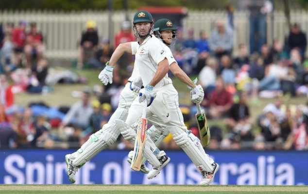 Australian batsmen Shaun Marsh and Adam Voges take more runs from the West Indies bowling on the second day of their first Test match in Hobart on Dece