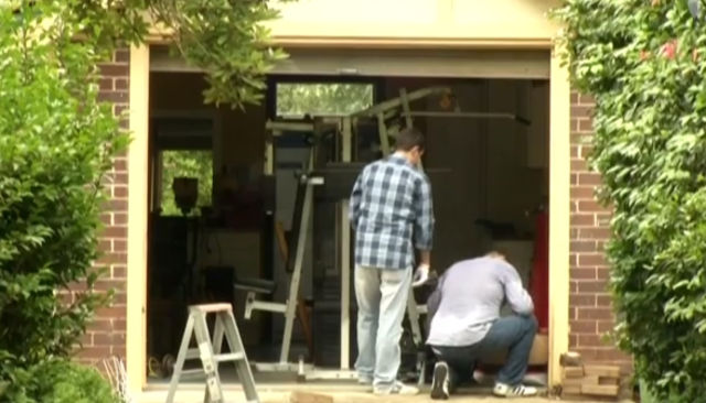 Australian police look through Craig Steven Wright's garage at his home in Sydney