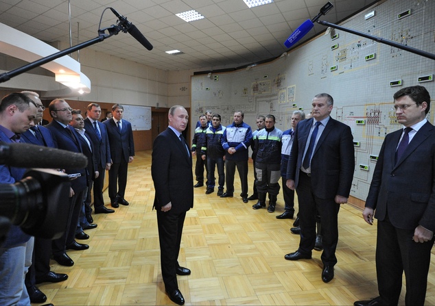 2 2015 Russian President Vladimir Putin center Crimean leader Sergei Aksyonov second right and Energy Minister Alex