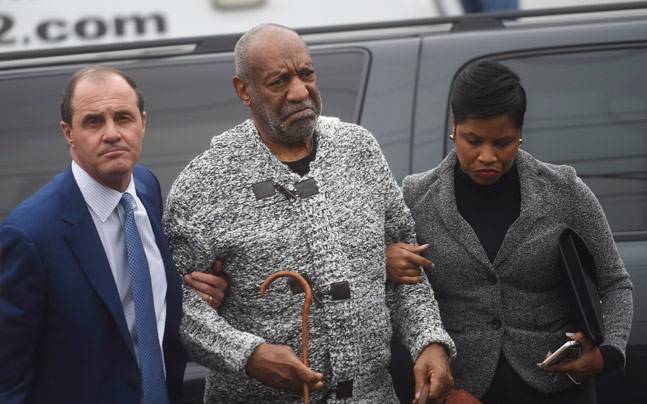 Bill Cosby with lawyers. Credit Reuters