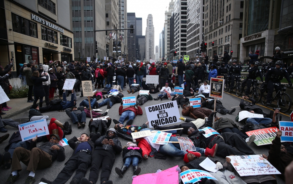 People participate in what organizers are calling a'Black Christmas protest on Michigan Avenue in downtown Chicago Thursday. E. Jason Wambsgans  Chicago Tribune  TNS via Getty Images