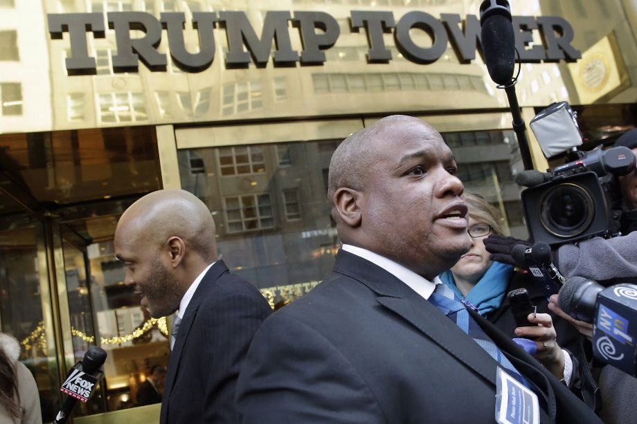 Pastor Mark Burns co-founder & CEO of Christian Television Network from Easley S.C. right speaks to the members of the media outside Trump Tower in New York