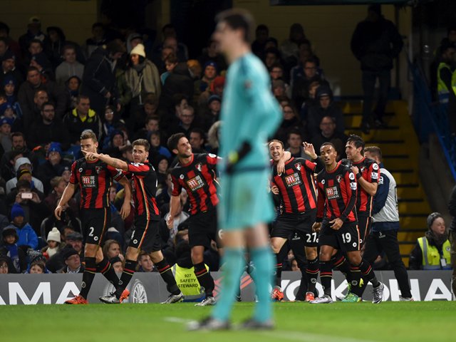 Bournemouth's Glenn Murray celebrates scoring their first goal with team mates as Chelsea's Thibaut Courtois looks dejected