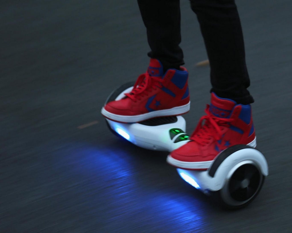 A person riding a hoverboard