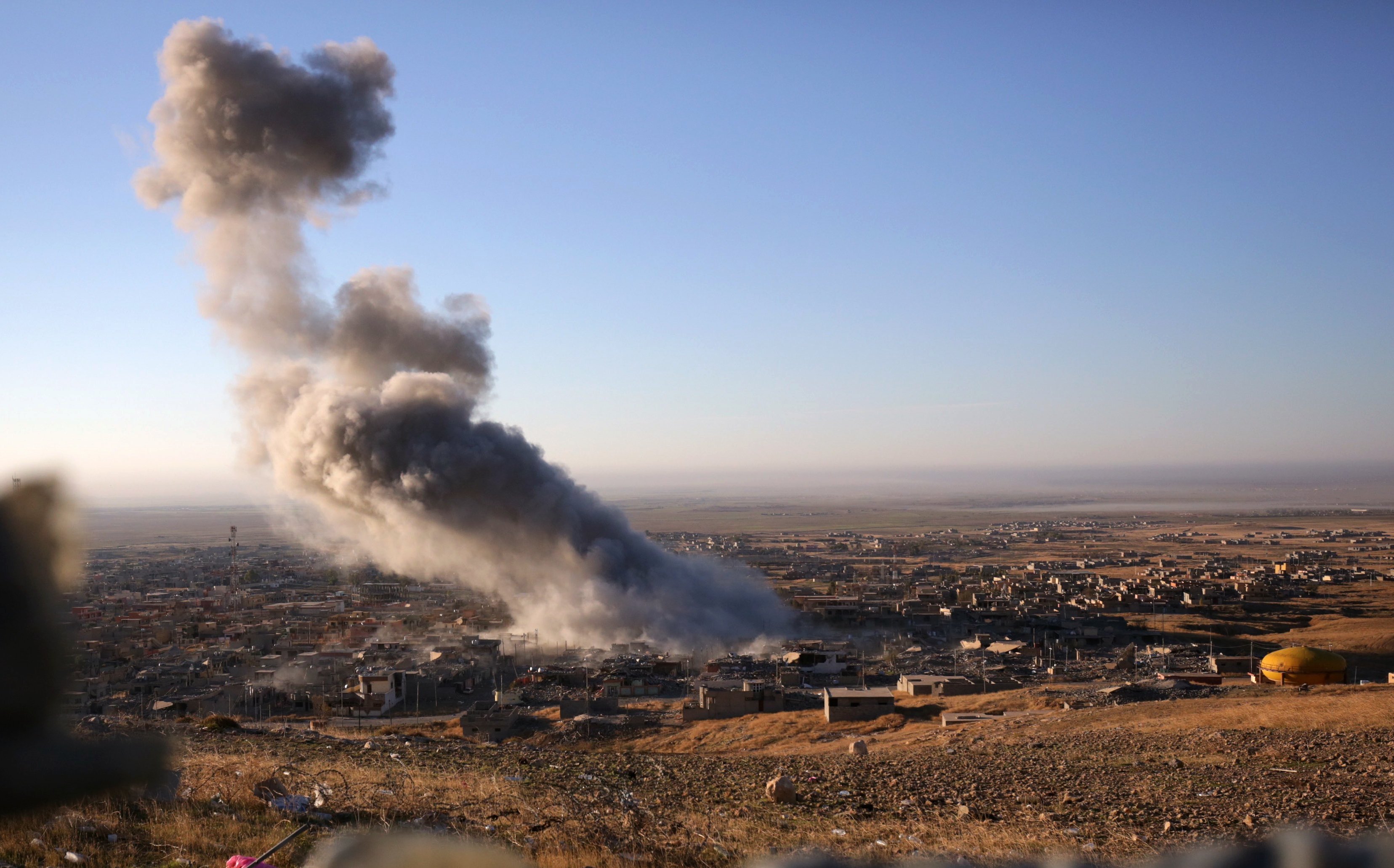 Bram Janssen—AP			Smoke believed to be from an airstrike billows over the northern Iraqi town of Sinjar Nov. 12 2015