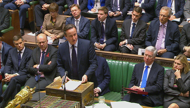 British Prime Minister David Cameron talks to lawmakers inside the House of Commons in London during a debate on launching airstrikes against Islamic State