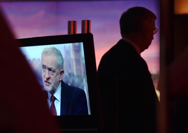 Labour Party leader Jeremy Corbyn on-screen and Defence Secretary Michael Fallon appearing on the BBC One current affairs programme The Andrew Marr Show on Sunday