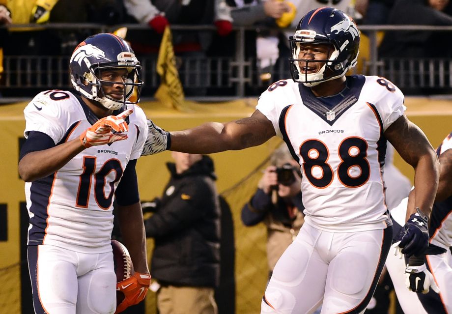 Denver Broncos wide receiver Emmanuel Sanders celebrates his touchdown with teammate Demaryius Thomas during the first half of an NFL football game against the Pittsburgh Steelers in Pittsburgh Sunday Dec. 20 2015