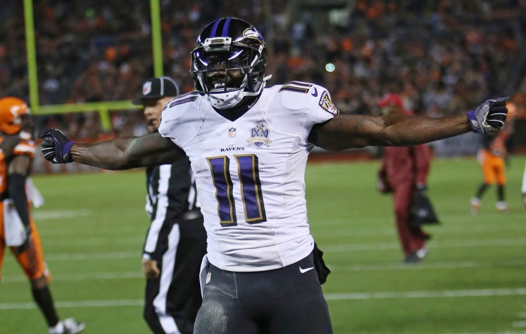 Baltimore Ravens wide receiver Kamar Aiken celebrates after scoring a 15-yard touchdown in the second half of an NFL football game against the Cleveland Browns Monday Nov. 30 2015 in Cleveland