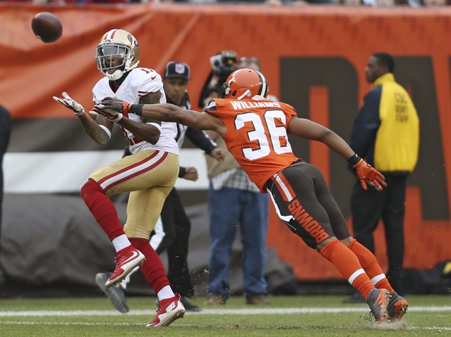 Cleveland Browns wide receiver Travis Benjamin catches a pass as San Francisco 49ers cornerback Dontae Johnson defends during the second half of an NFL football game Sunday Dec. 13 2015 in Cleveland. There was a penalty on the play. (AP Phot