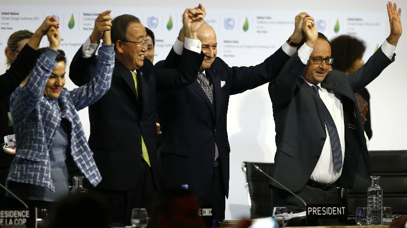 French President Francois Hollande right French Foreign Minister and president of the COP21 Laurent Fabius second right United Nations climate chief Christiana Figueres and United Nations Secretary General Ban ki Moon hold their hands up after the