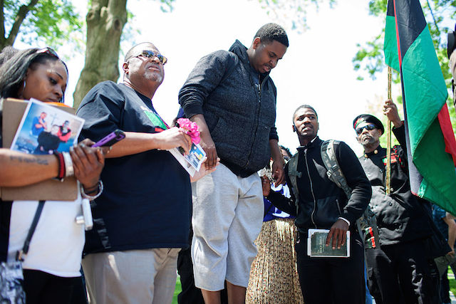 CLEVELAND OH- MAY 23 Protestors sing in front of a mock casket for Tamir Rice