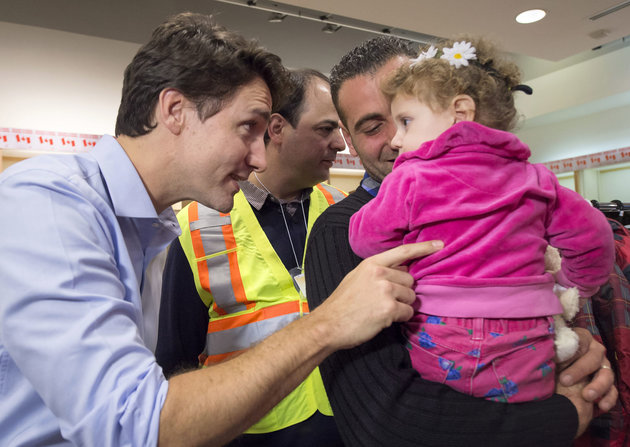 Syrian refugees headed to Canada on first planeload