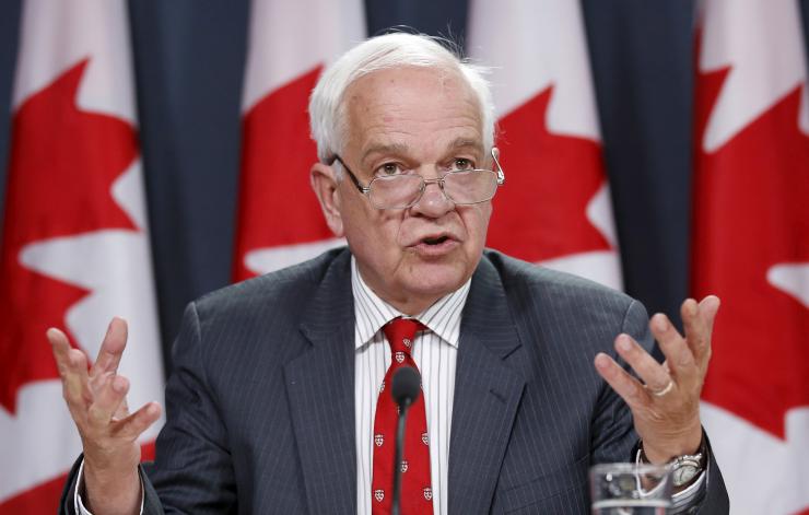 Canada's Immigration Minister John Mc Callum speaks during a news conference in Ottawa Canada