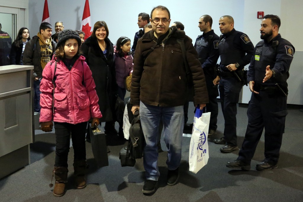 Syrian refugees headed to Canada on first planeload