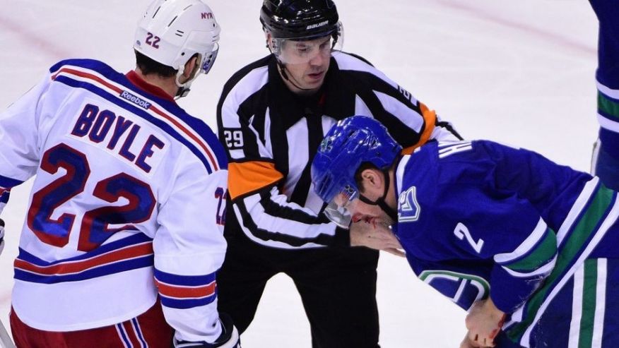 Dec 9 2015 Vancouver British Columbia CAN Vancouver Canucks defenseman Dan Hamhuis takes a puck to the face during the third period against the New York Rangers at Rogers