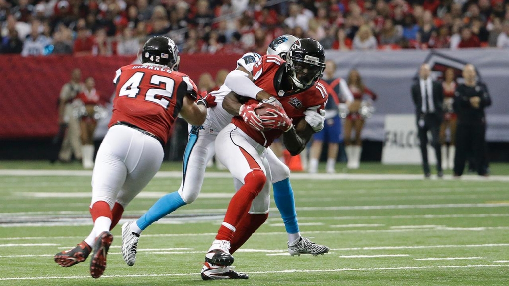 Atlanta Falcons wide receiver Julio Jones makes his fifth catch of the day against Carolina Panthers cornerback Josh Norman during the second half of an NFL football game