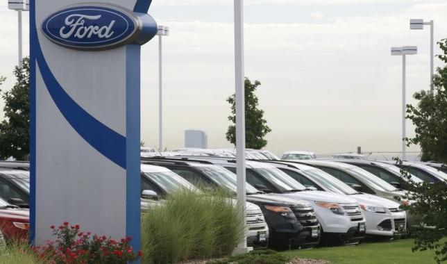 Cars are lined up for sale at a Ford dealer in Lakewood Colorado in this