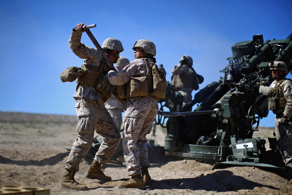 Pentagon chief Ash Carter is expected to announce that women can now serve in frontline combat posts. Here Carolina Ortiz moves away from a 155 mm artillery piece after loading it during a live-fire exercise at the Marine base in Twentynine Palms Calif