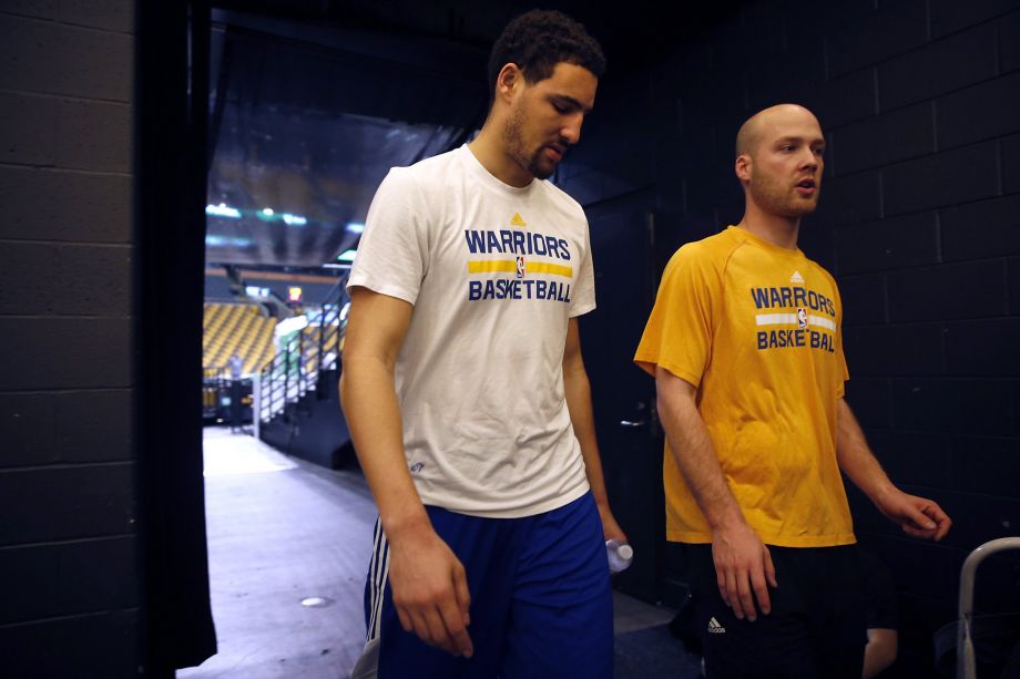 Golden State Warriors Klay Thompson and head athletic trainer Drew Yoder head to locker room after shootaround at TD Garden in Boston Massachusetts on Friday