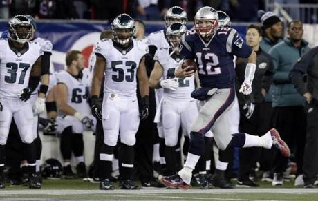 Patriots quarterback Tom Brady ran along the sideline after catching a second-half pass from Danny Amendola