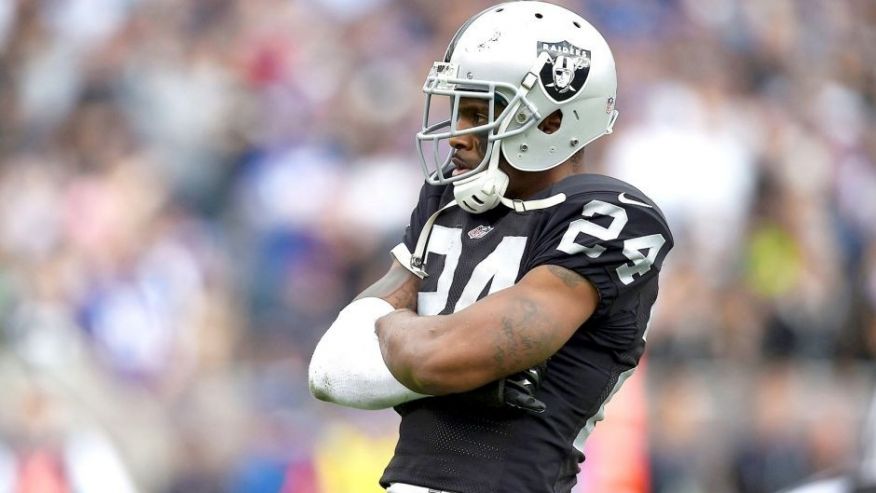 OAKLAND CA- DECEMBER 21 Charles Woodson #24 of the Oakland Raiders celebrates after an interception in the first quarter against the Buffalo Bills