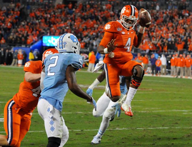 Clemson quarterback Deshaun Watson leaps for a touchdown in the fourth quarter one of his five TDs in the game