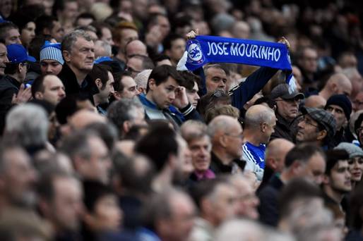 Chelsea fan holds up a scarf for Jose Mourinho at Stamford Bridge today