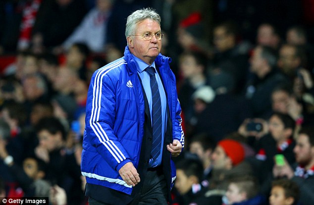 Chelsea manager Guus Hiddink insists Cesc Fabregas is happy with the Premier League champions