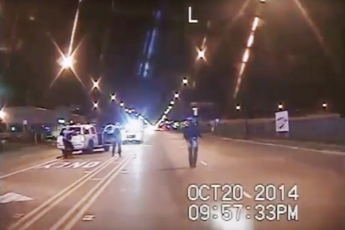 In this Oct. 20 2014 frame from dash-cam video provided by the Chicago Police Department Laquan Mc Donald right walks down the street moments before being shot by officer Jason Van Dyke in Chicago. Van Dyke who shot Mc Donald 16 times was charged with