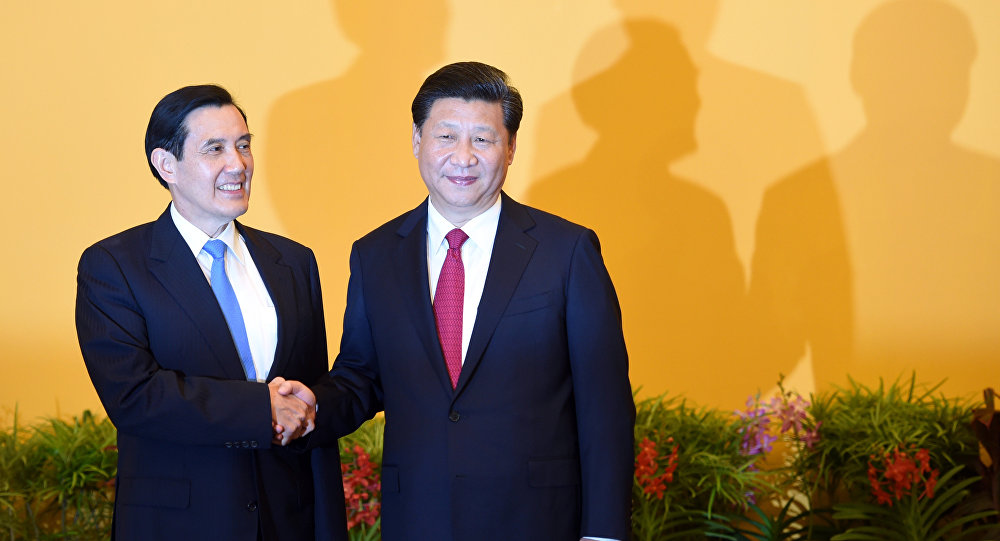 Chinese President Xi Jinping shakes hands with Taiwan President Ma Ying-jeou before their meeting at Shangrila hotel in Singapore