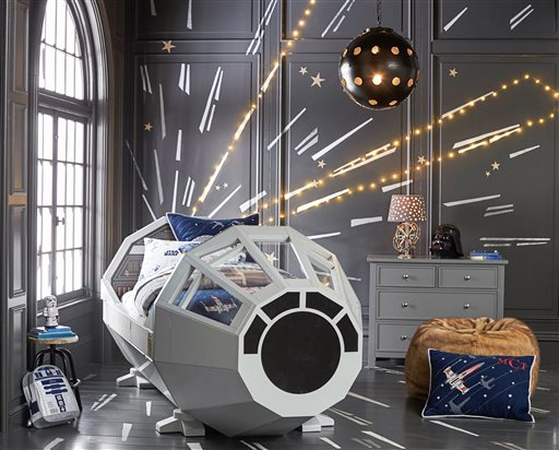 Barn Kids shows a Star Wars Millennium Falcon bed. “Star Wars The Force Awakens” opens in U.S. theaters Dec. 18 2015 and it’s bringing a galaxy of new merchandise with it from Chewbacca coffee creamers (Wo