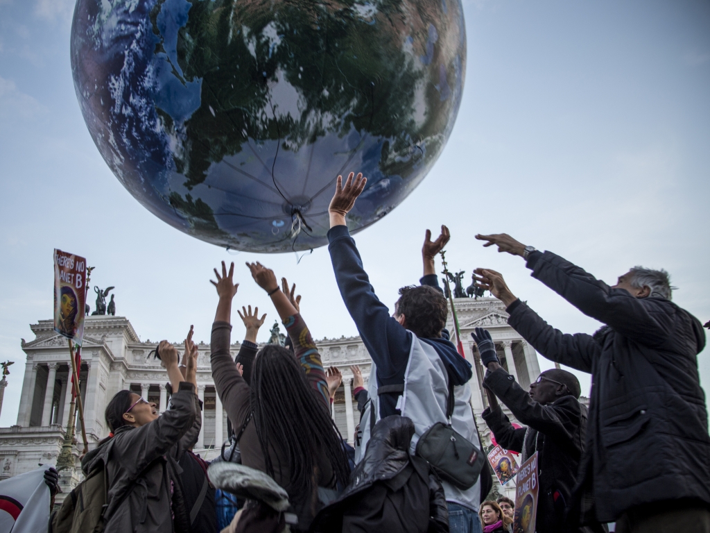 Climate protesters in Rome demonstrate while negotiators discuss what to do about global warming in Paris this week