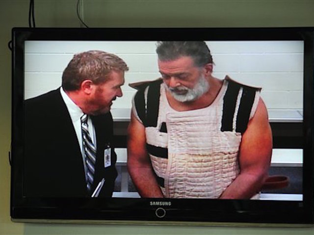 Robert Lewis Dear looks back at the after one of his outbursts Wednesday at a hearing in Colorado Springs